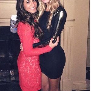Black/gold small BEBE long sleeve cocktail dress.